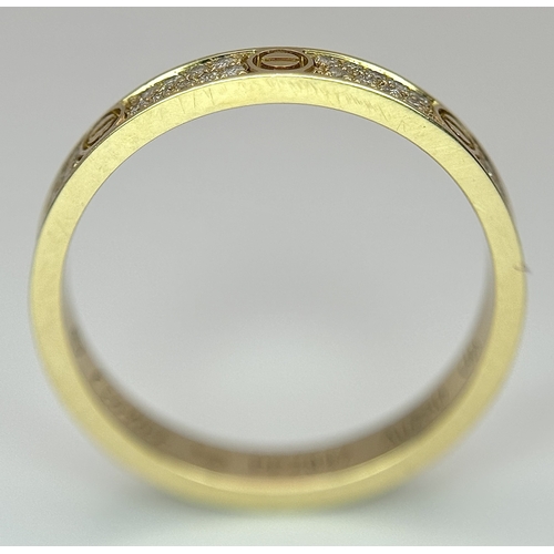 29 - An 18K Gold and Diamond Pave Cartier Love Band Ring. 4mm width. Size 50. 2.1g. Comes with a Cartier ... 