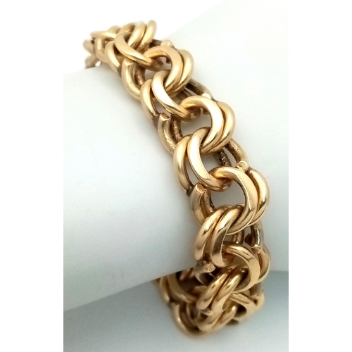 51 - A SUPERB DOUBLE FANCY LINK BRACELET IN 14K GOLD WITH SAFETY CATCH IN AS NEW CONDITION . A SERIOUSLY ... 