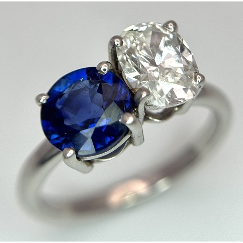 120 - A Spectacular W.G.I Certified 18K White Gold Sapphire and Diamond Ring. An oval cut 1.01ct diamond a... 