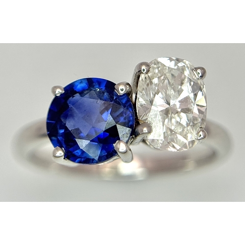 120 - A Spectacular W.G.I Certified 18K White Gold Sapphire and Diamond Ring. An oval cut 1.01ct diamond a... 