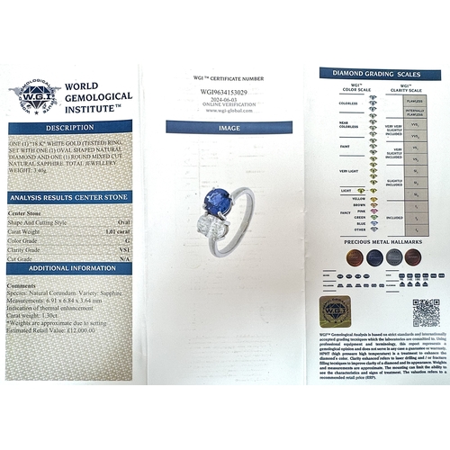 120 - A Spectacular W.G.I Certified 18K White Gold Sapphire and Diamond Ring. An oval cut 1.01ct diamond a... 
