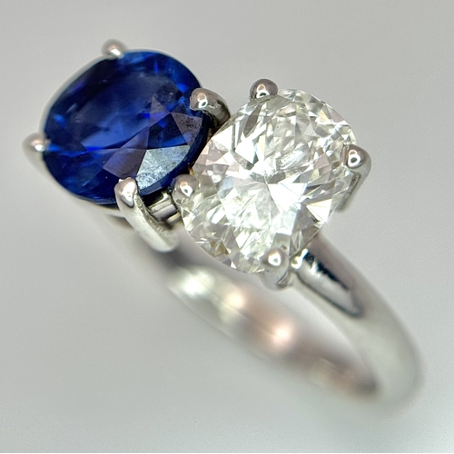 120 - A Spectacular W.G.I Certified 18K White Gold Sapphire and Diamond Ring. An oval cut 1.01ct diamond a... 