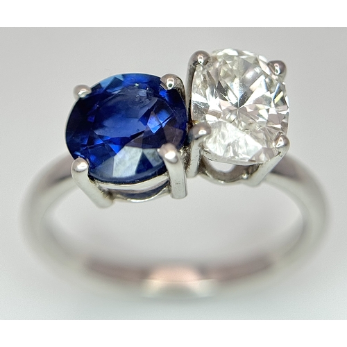 120 - A Spectacular W.G.I Certified 18K White Gold Sapphire and Diamond Ring. An oval cut 1.01ct diamond a... 