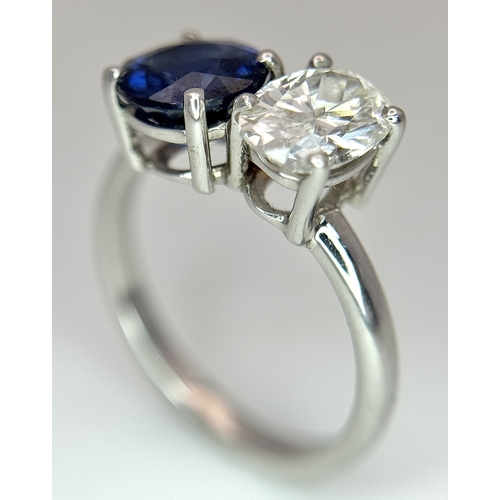 120 - A Spectacular W.G.I Certified 18K White Gold Sapphire and Diamond Ring. An oval cut 1.01ct diamond a... 