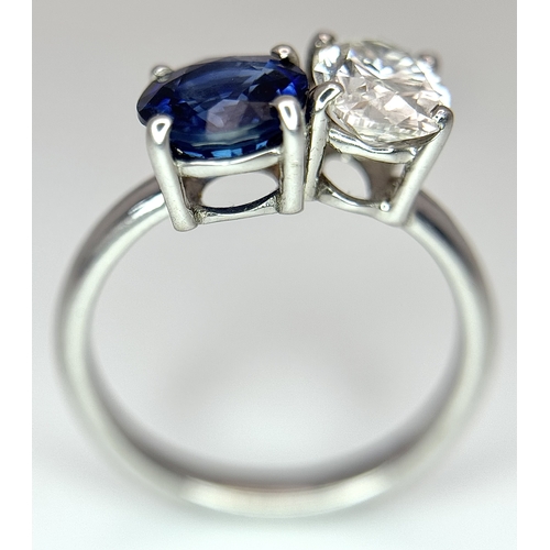 120 - A Spectacular W.G.I Certified 18K White Gold Sapphire and Diamond Ring. An oval cut 1.01ct diamond a... 