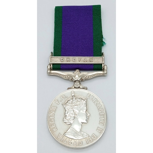 94 - A General Service Medal 1962 with clasp Dhofar, named to: 24068855 Sig A L Curle R Signals.
The clas... 