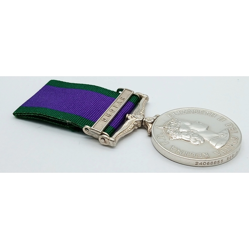 94 - A General Service Medal 1962 with clasp Dhofar, named to: 24068855 Sig A L Curle R Signals.
The clas... 