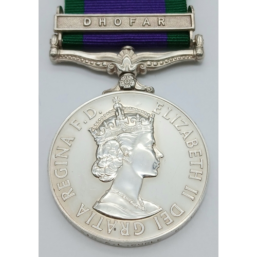 94 - A General Service Medal 1962 with clasp Dhofar, named to: 24068855 Sig A L Curle R Signals.
The clas... 