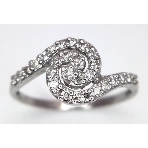 96 - AN 18K WHITE GOLD DIAMOND SET SPIRAL RING - 0.25CTW. 2.2G. SIZE M. SC6062.