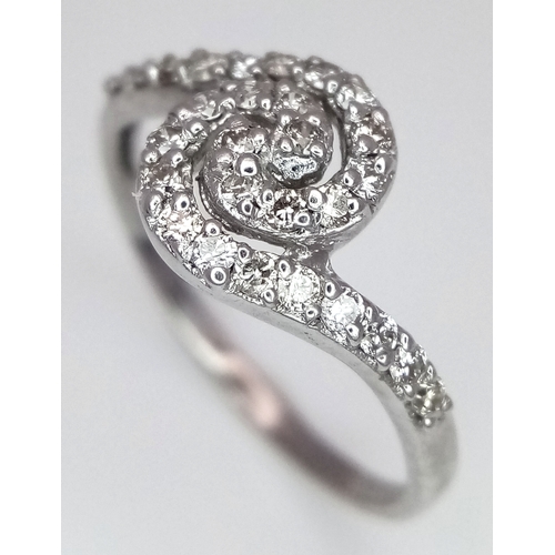 96 - AN 18K WHITE GOLD DIAMOND SET SPIRAL RING - 0.25CTW. 2.2G. SIZE M. SC6062.