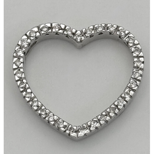68 - AN 18K WHITE GOLD DIAMOND SET HEART PENDANT. 0.25CTW. 3.3G. SC6058.