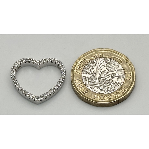 68 - AN 18K WHITE GOLD DIAMOND SET HEART PENDANT. 0.25CTW. 3.3G. SC6058.