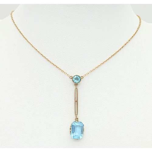 84 - Delightful 9 CARAT GOLD NECKLACE with integrated BLUE TOPAZ DROP PENDANT. 3.25 Grams. 44 cm includin... 