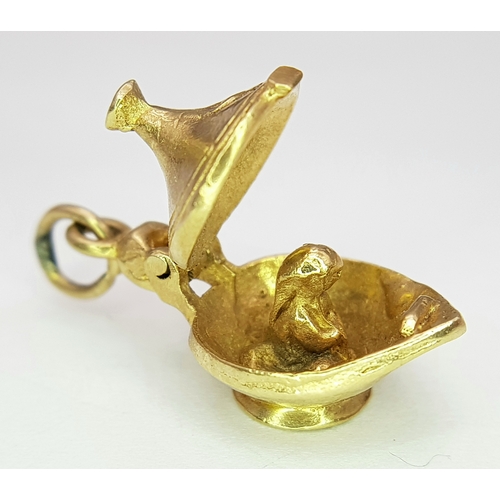 1145 - A 9k yellow gold Genie's magic lamp opening charm/pendant.  5.4g. SH2362I