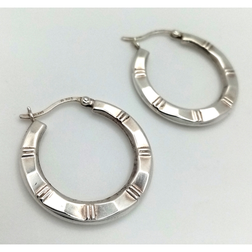 1272 - A pair of 925 silver fashion hoop earrings. Total weight 3.1G.