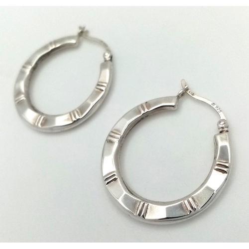1272 - A pair of 925 silver fashion hoop earrings. Total weight 3.1G.