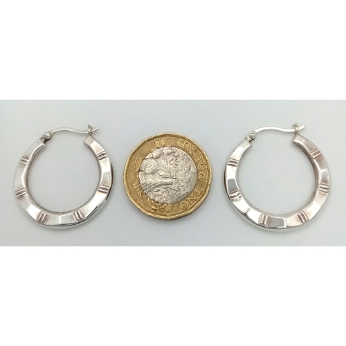 1272 - A pair of 925 silver fashion hoop earrings. Total weight 3.1G.