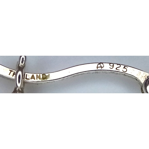 1272 - A pair of 925 silver fashion hoop earrings. Total weight 3.1G.