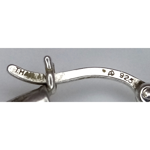 1286 - A 925 silver pair of textured fashion hoop earrings. Total weight 3.4G.