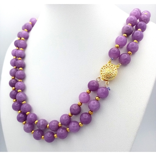 1373 - A Two Row Purple Kunzite Beaded Necklace. 8mm beads. Gilded spacers and clasp. 42-44cm necklace leng... 