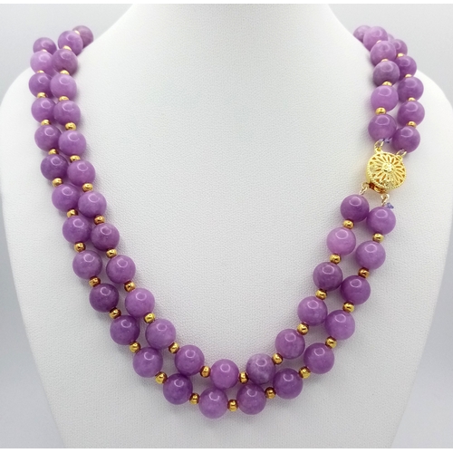 1373 - A Two Row Purple Kunzite Beaded Necklace. 8mm beads. Gilded spacers and clasp. 42-44cm necklace leng... 