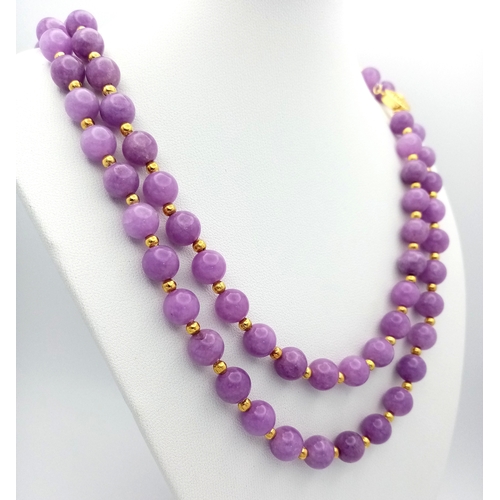 1373 - A Two Row Purple Kunzite Beaded Necklace. 8mm beads. Gilded spacers and clasp. 42-44cm necklace leng... 