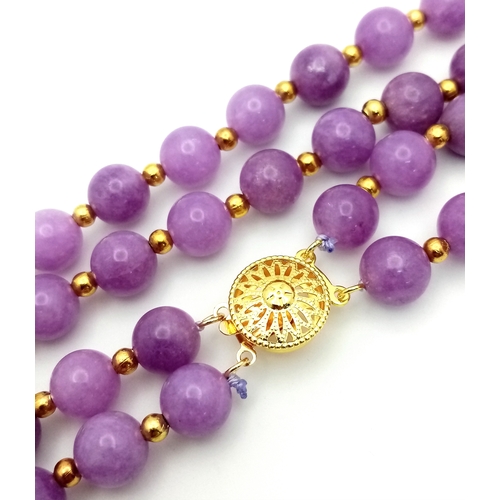 1373 - A Two Row Purple Kunzite Beaded Necklace. 8mm beads. Gilded spacers and clasp. 42-44cm necklace leng... 