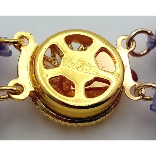 1373 - A Two Row Purple Kunzite Beaded Necklace. 8mm beads. Gilded spacers and clasp. 42-44cm necklace leng... 