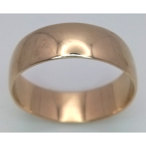 32 - A Large 9K Yellow Gold Band Ring. 9mm width. Size Z +6. 7.7g.