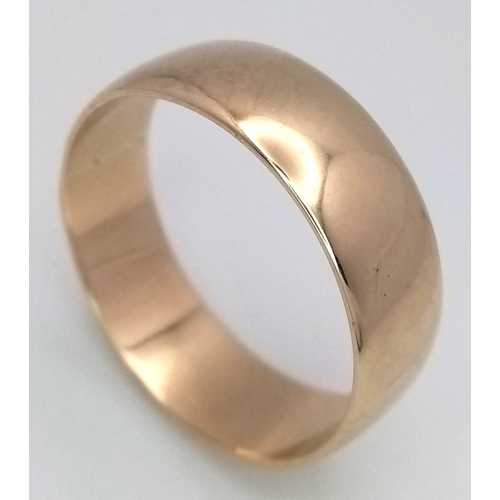 32 - A Large 9K Yellow Gold Band Ring. 9mm width. Size Z +6. 7.7g.