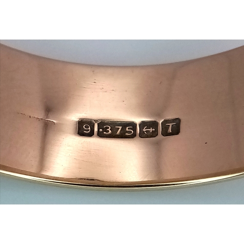 32 - A Large 9K Yellow Gold Band Ring. 9mm width. Size Z +6. 7.7g.