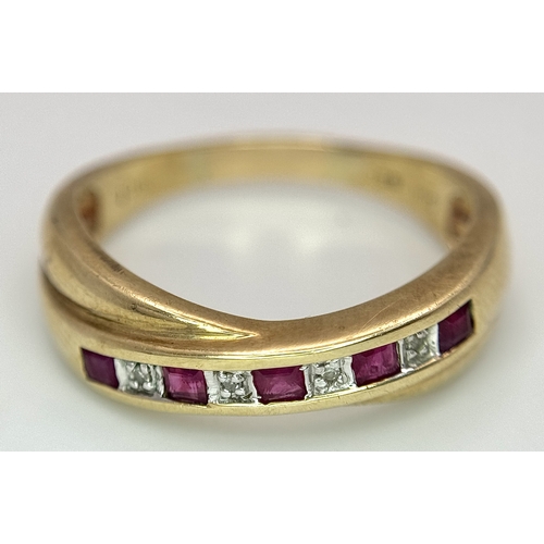 43 - A 9K Yellow Gold Ruby and Diamond Crossover Ring. Size R. 2.83g.