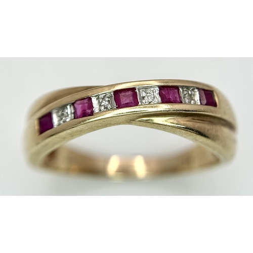 43 - A 9K Yellow Gold Ruby and Diamond Crossover Ring. Size R. 2.83g.