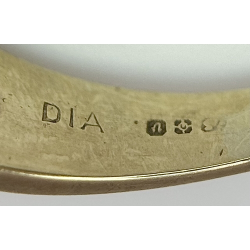 43 - A 9K Yellow Gold Ruby and Diamond Crossover Ring. Size R. 2.83g.