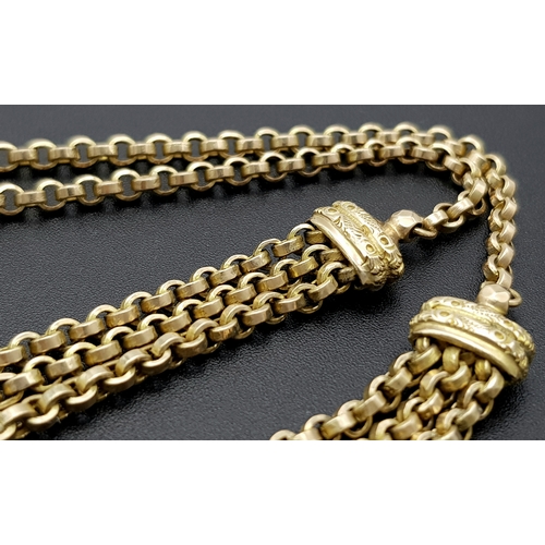 45 - An Antique 9K Gold Albertina Watch Chain with Coin Locket Fob. 42cm. 26.05g.