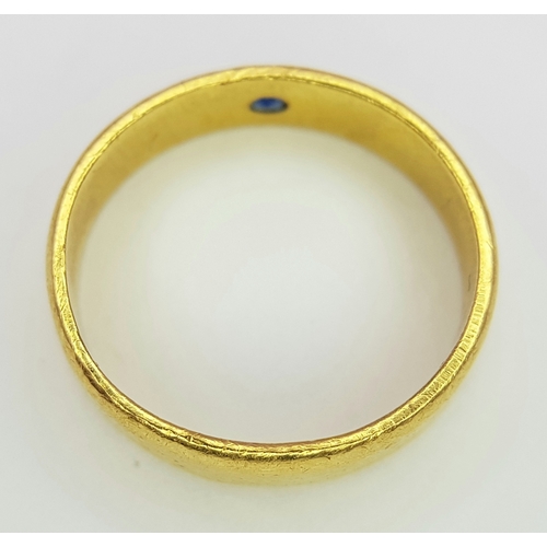 50 - A 22K Yellow Gold Band Ring with Sapphire Star Set Gemstone. 6mm width. Size J. 4.3g.