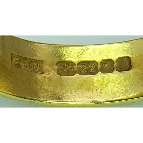 50 - A 22K Yellow Gold Band Ring with Sapphire Star Set Gemstone. 6mm width. Size J. 4.3g.