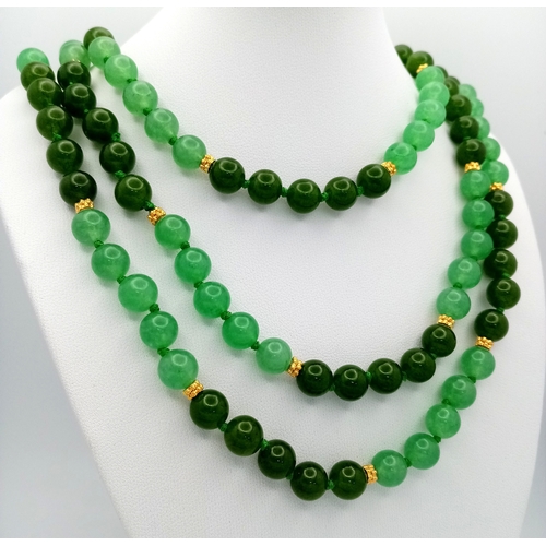 529 - A Rope Length Jade Necklace. Two shades of green. 150cm necklace length.