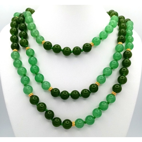 529 - A Rope Length Jade Necklace. Two shades of green. 150cm necklace length.