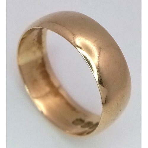 60 - An 18K Yellow Gold Band Ring. UK hallmarks. 7mm width. size N. 4.05g.