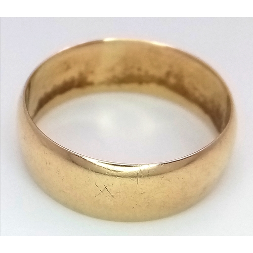 60 - An 18K Yellow Gold Band Ring. UK hallmarks. 7mm width. size N. 4.05g.