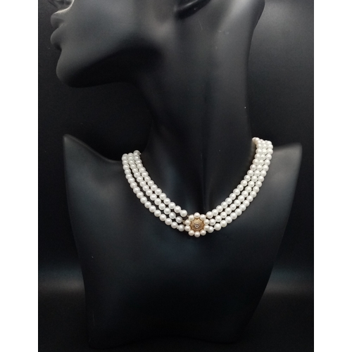 736 - A Three Row White Pearl Choker Necklace with 9K Gold and Diamond Clasp. Pearls 5/6mm. 30-34cm. Ref: ... 