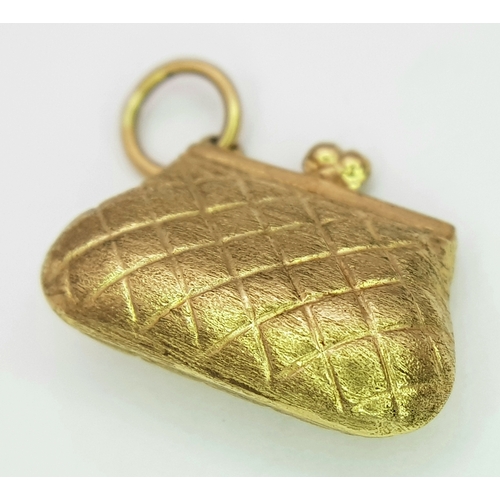753 - A 9k yellow gold purse charm/pendant. 1.1g. SH2366I