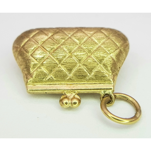 753 - A 9k yellow gold purse charm/pendant. 1.1g. SH2366I