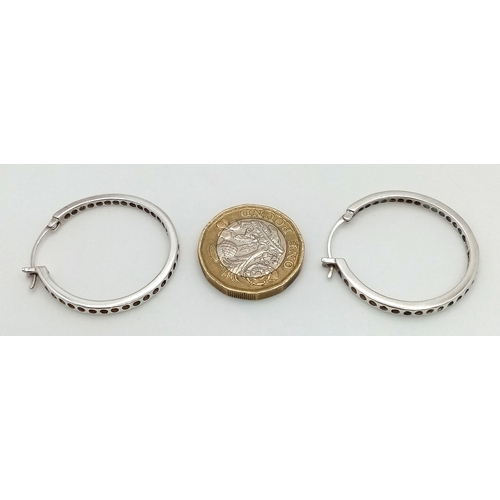 1300 - A stunning pair of 925 silver CZ fashion hoop earrings. Total weight 5.3G.