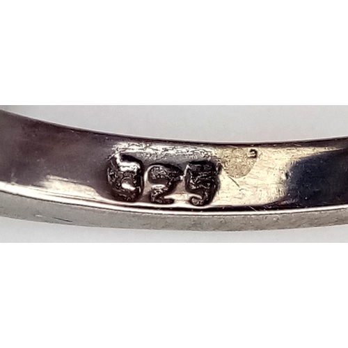 527 - A 5ct Blue Sapphire Ring with a halo of Blue Sapphire Accents. Set in 925 Silver. Size M 1/2. With c... 