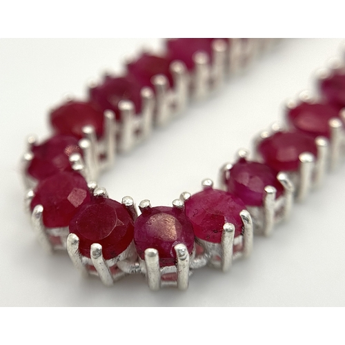 718 - A Ruby Gemstone Tennis Necklace. Set in 925 Silver. 46cm.
CD-2054.