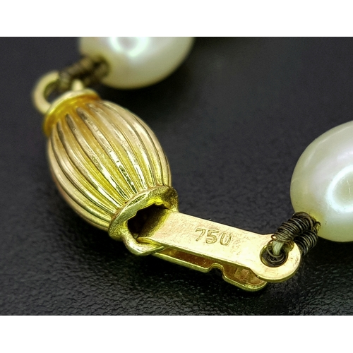 22 - A Cellini Rice Pearl Necklace with 18K Gold Clasp. 44cm length. Comes with a Cellini case.