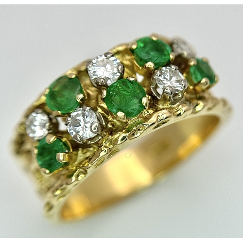 37 - An 18K Yellow Gold Emerald and Diamond Band Ring. c. 0.50ctw of round cut emeralds and c. 0.50ctw of... 