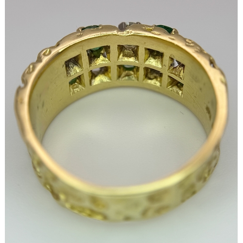 37 - An 18K Yellow Gold Emerald and Diamond Band Ring. c. 0.50ctw of round cut emeralds and c. 0.50ctw of... 